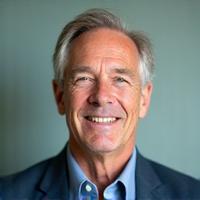 Portrait of Michael T., 55, smiling and healthy.