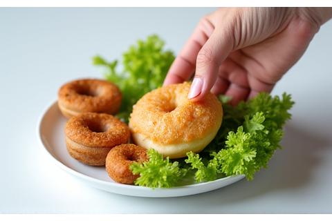 Image showing a hand removing unhealthy foods from a plate.