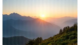 Sunrise over mountains, signifying a fresh start and positive beginnings.